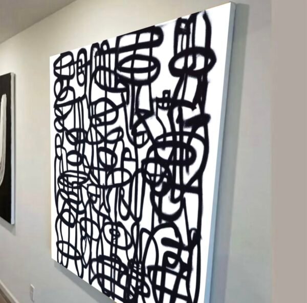 Robert R – Black and White Modern Abstract Painting, Angled Detail Close-up angled view of a black-and-white modern abstract painting with bold graffiti-inspired lines and a visible white canvas edge against a gallery wall.